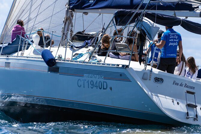 Catania: Sail Cyclops Coast by Boat and Enjoy a Sicilian Aperitif - The black coastline stop: where the sea turns dramatic