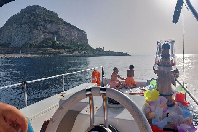 Discovering Cefalù's Coastline Activity on a Mini Catamaran - The Host Team: Sophy, Giovanni, and the Calm, Capable Feel