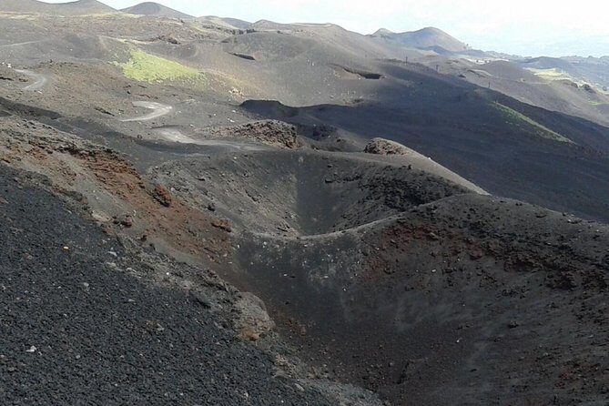 Etna trekking tour - The descent: sandy canyons, ash, and the observatory at Piano delle Concazze