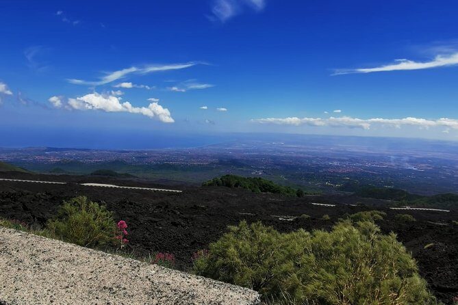 From Catania: Private mt. Etna trekking and pic-nic - Grotta di Serracozzo: stepping into a lava cave with helmets and torches