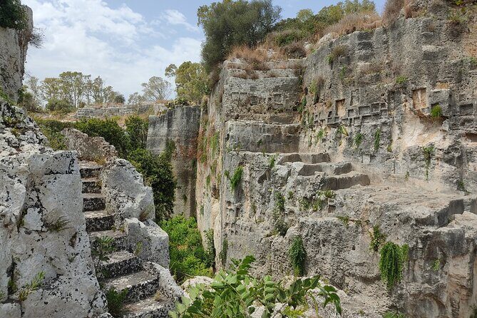 Group guided tour of the archaeological park of Neapolis - Syracuse Roman Amphitheater: when the story shifts into Roman hands