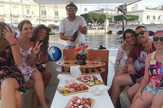 Syracuse Aperitif boat at Sunset island and sea caves - Aperitif Time: Prosecco, Music, and the Sunset Build-Up