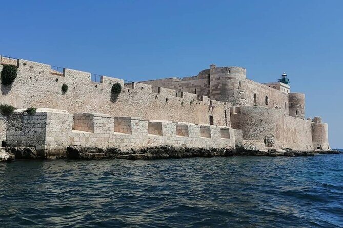 Syracuse Boat Excursion with Snorkeling to the Sea Caves - Isola di Ortigia: your first swim stop under the castle