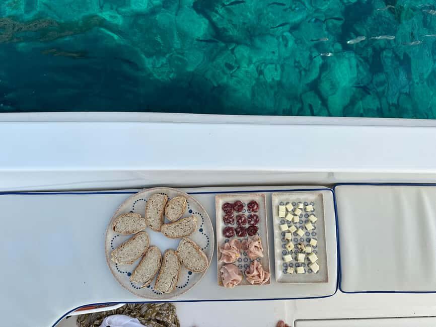 Taormina: Boat Tour with Sicilian Wine Tasting - Traditional Sicilian cuisine plus the sea air factor