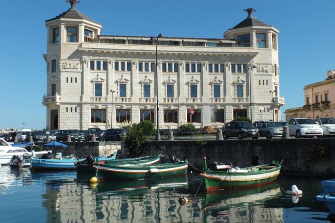 Tour of the island of Ortigia and exploration of sea caves with baths. - Captain and Guide Styles: Franco, Laura, Stefano, and Steven